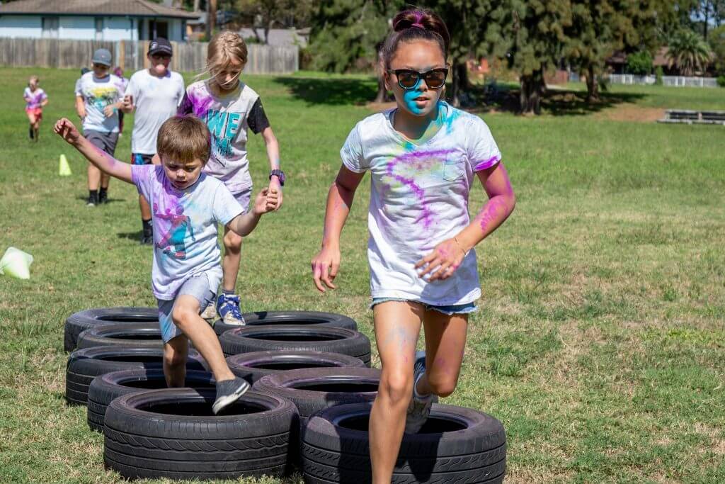 Giant tires or inflatable hoops are one of the best fun run obstacles.